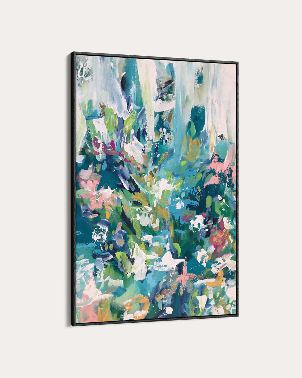 Abstract painting with vibrant colors in a black frame on a white background