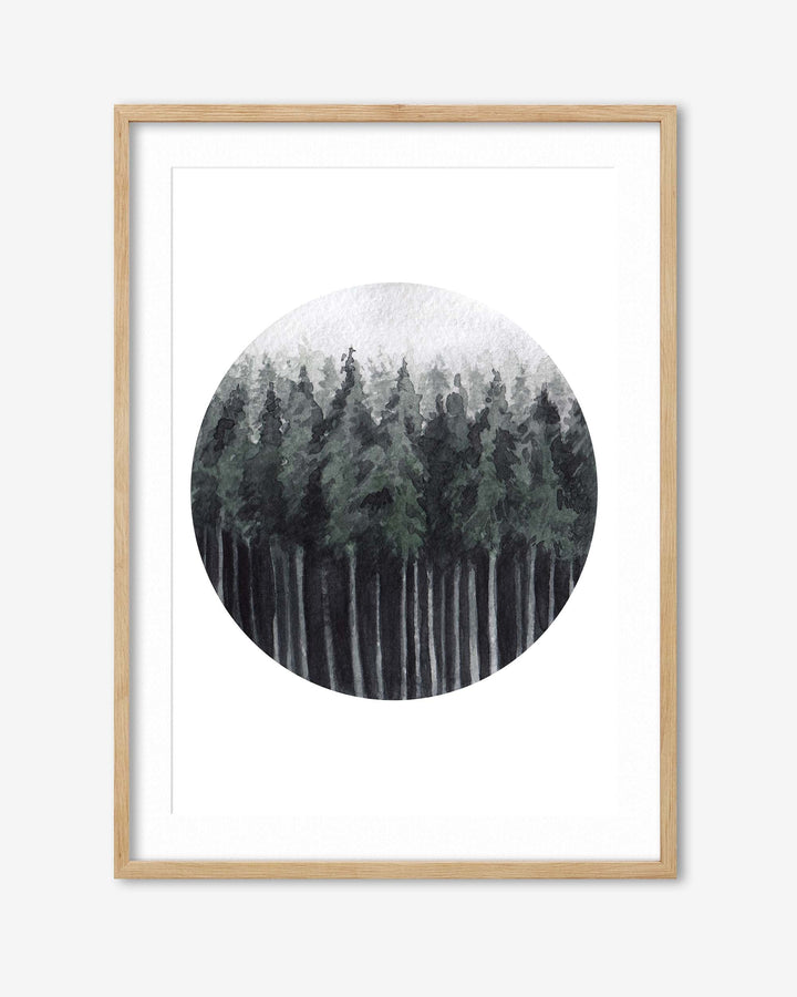 Framed artwork of a snowy forest scene with a circular inset