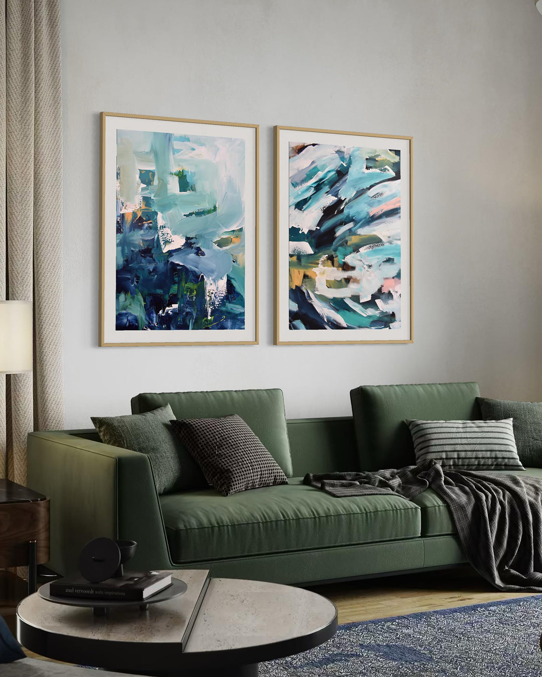 Green sofa in a living room with abstract art on the wall