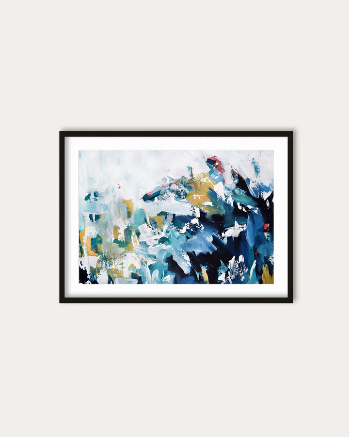 Framed abstract painting with blue, green, and white colors on a light gray wall.