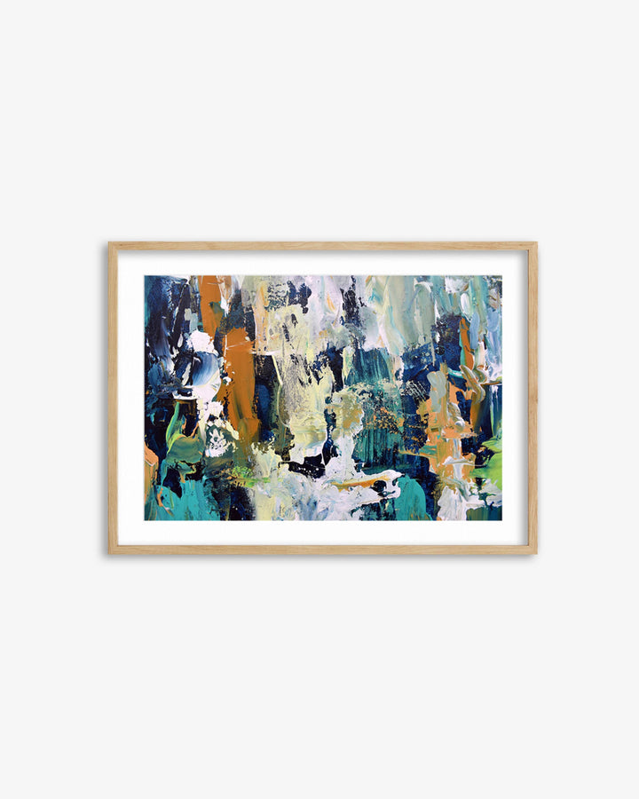 Framed abstract art print with a wooden frame on a white wall