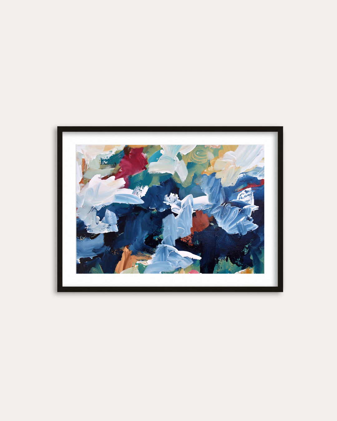 Framed abstract artwork with colorful flowers on a white wall