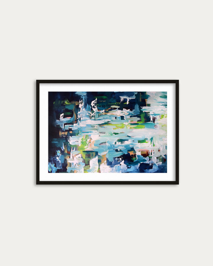 Framed abstract painting on a white wall