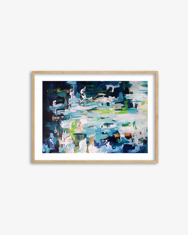 Framed abstract painting with a colorful design on a white wall