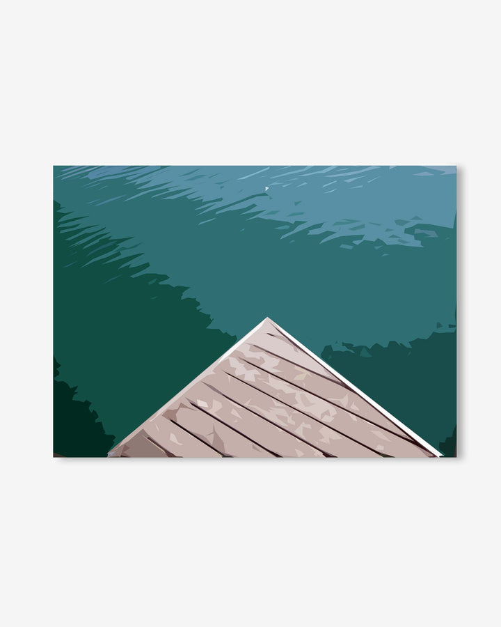 Wooden dock extending into a body of water with trees in the background