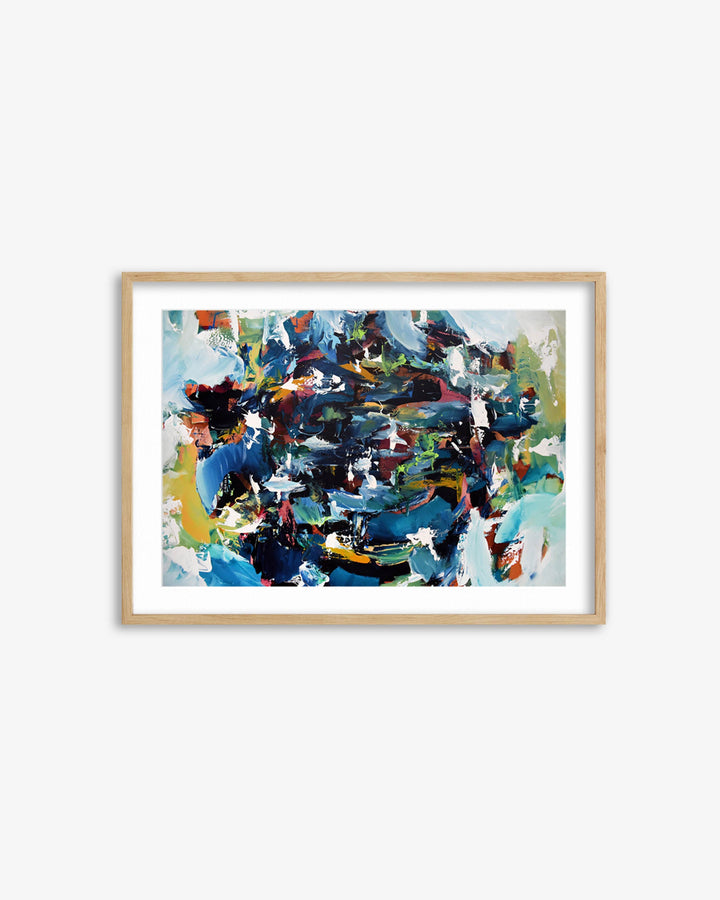 Framed abstract artwork with a colorful design on a white wall