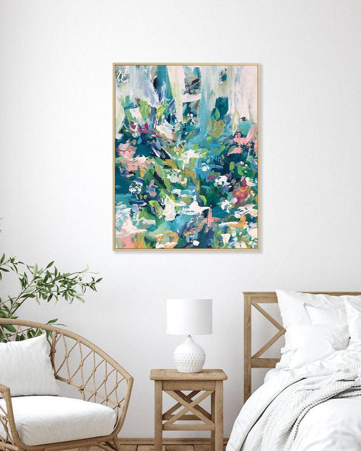 Abstract painting on a wall in a bedroom with a chair, nightstand, and bed.