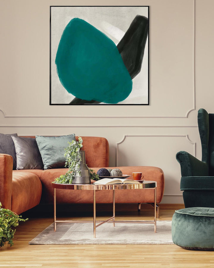 Modern living room with a brown sofa, green armchair, and abstract art on the wall.