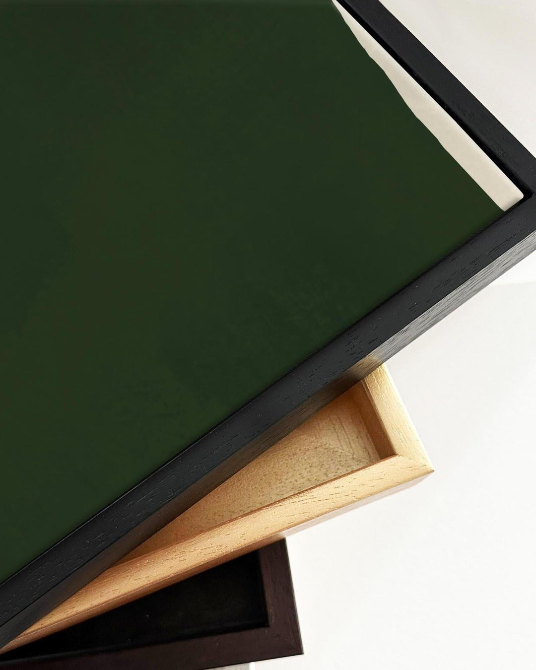 Close up detail of framed canvas art painting print with float frame in many colours.