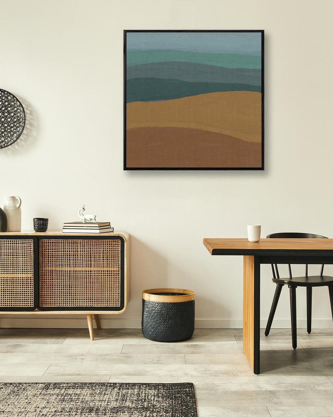 Modern interior with a wooden sideboard, abstract wall art, and a dining table.
