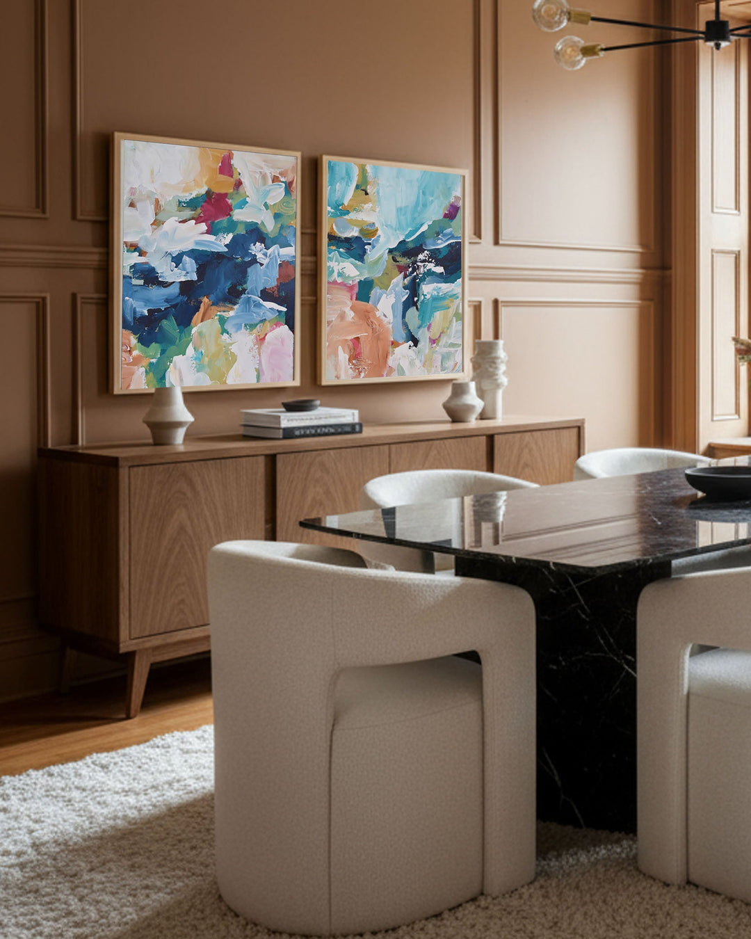 Dining room with a table, chairs, and abstract art on the wall.