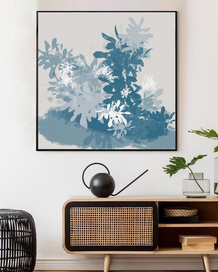 Framed abstract art above a wooden console table with decorative items.