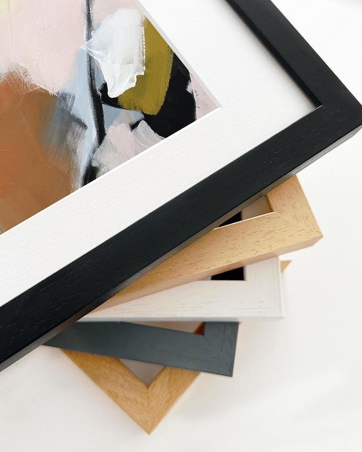 Stack of various photo frames on a white background
