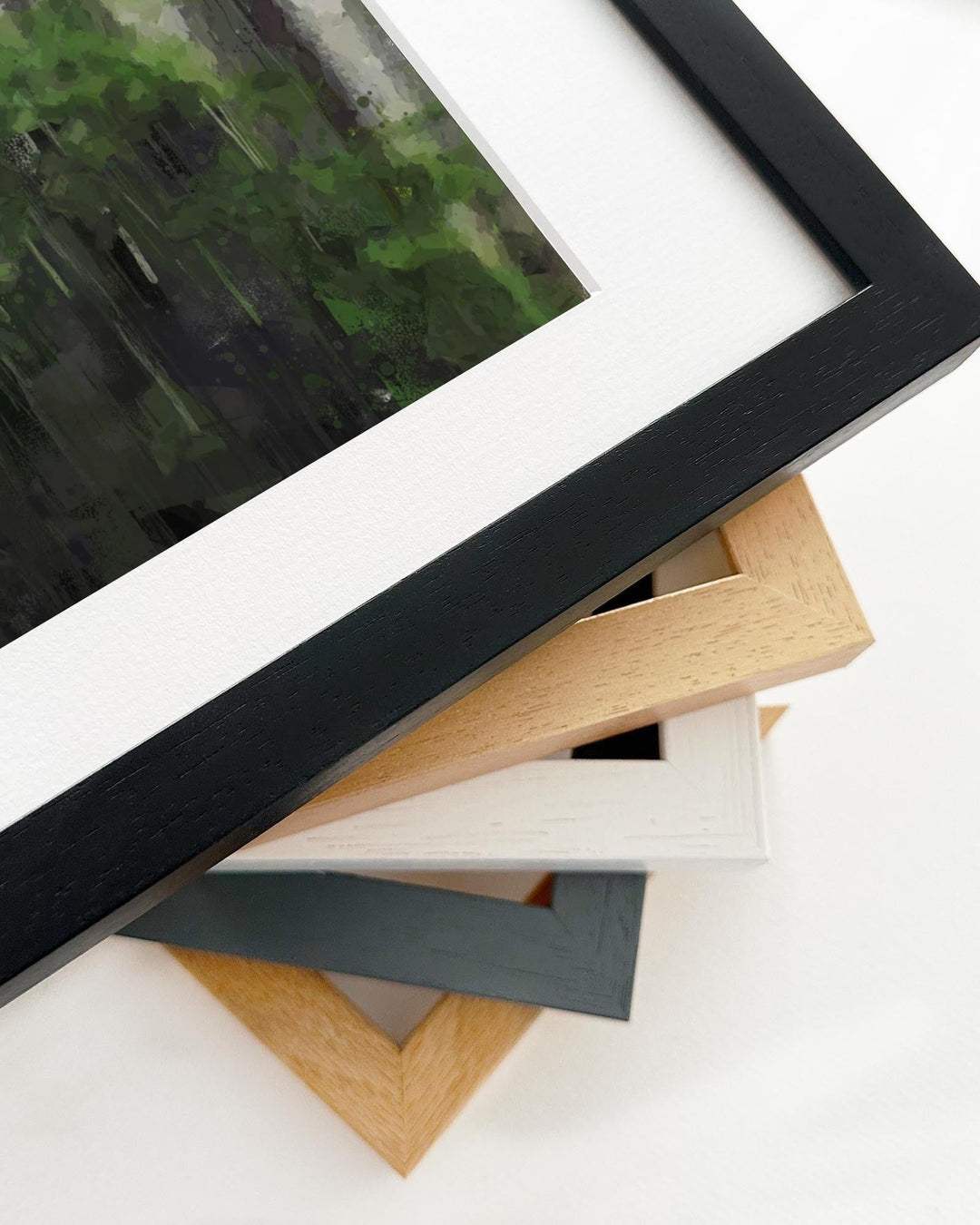 Collection of different colored picture frames on a white background