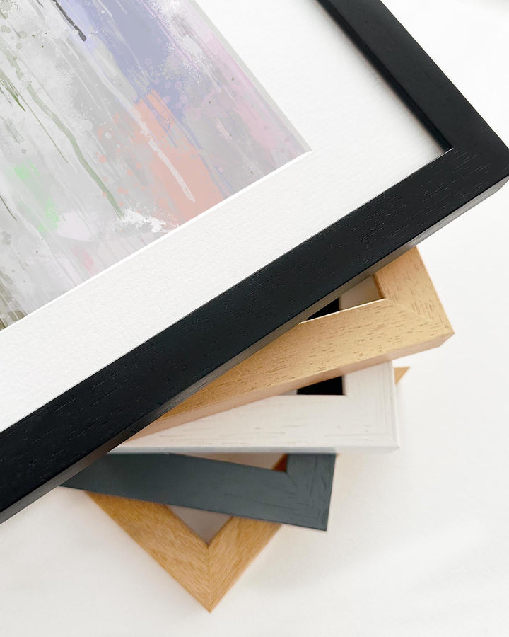 Collection of various photo frames on a white surface