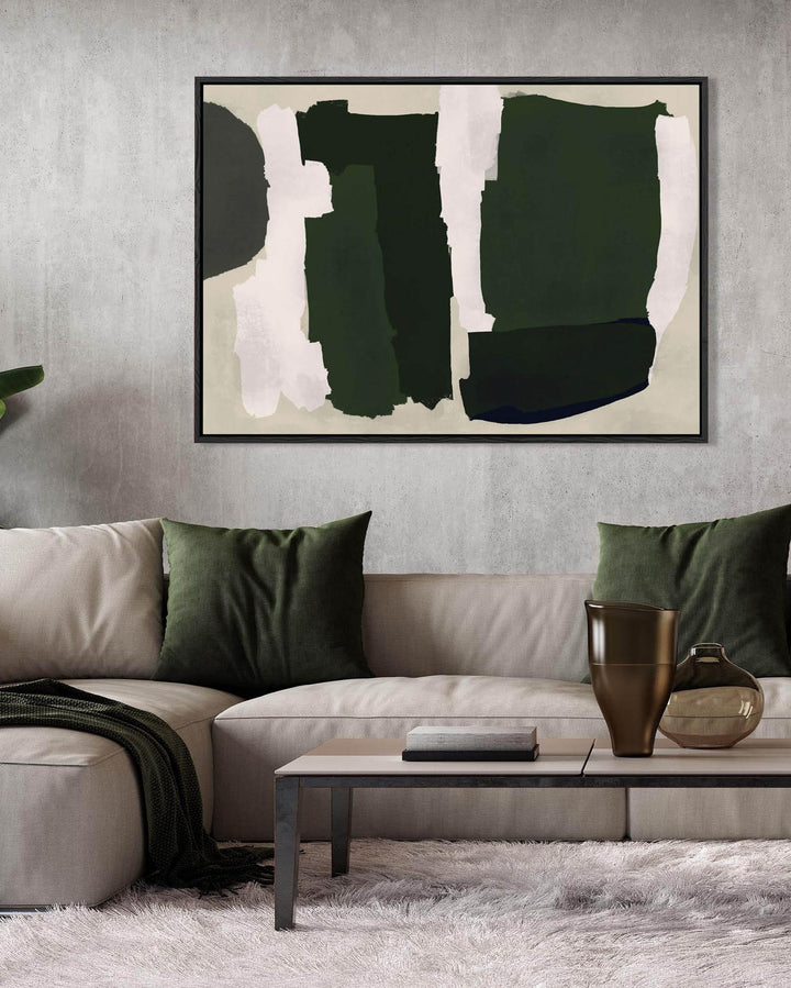 Large abstract art piece on canvas on a wall above a beige three seater sofa with green cushions.