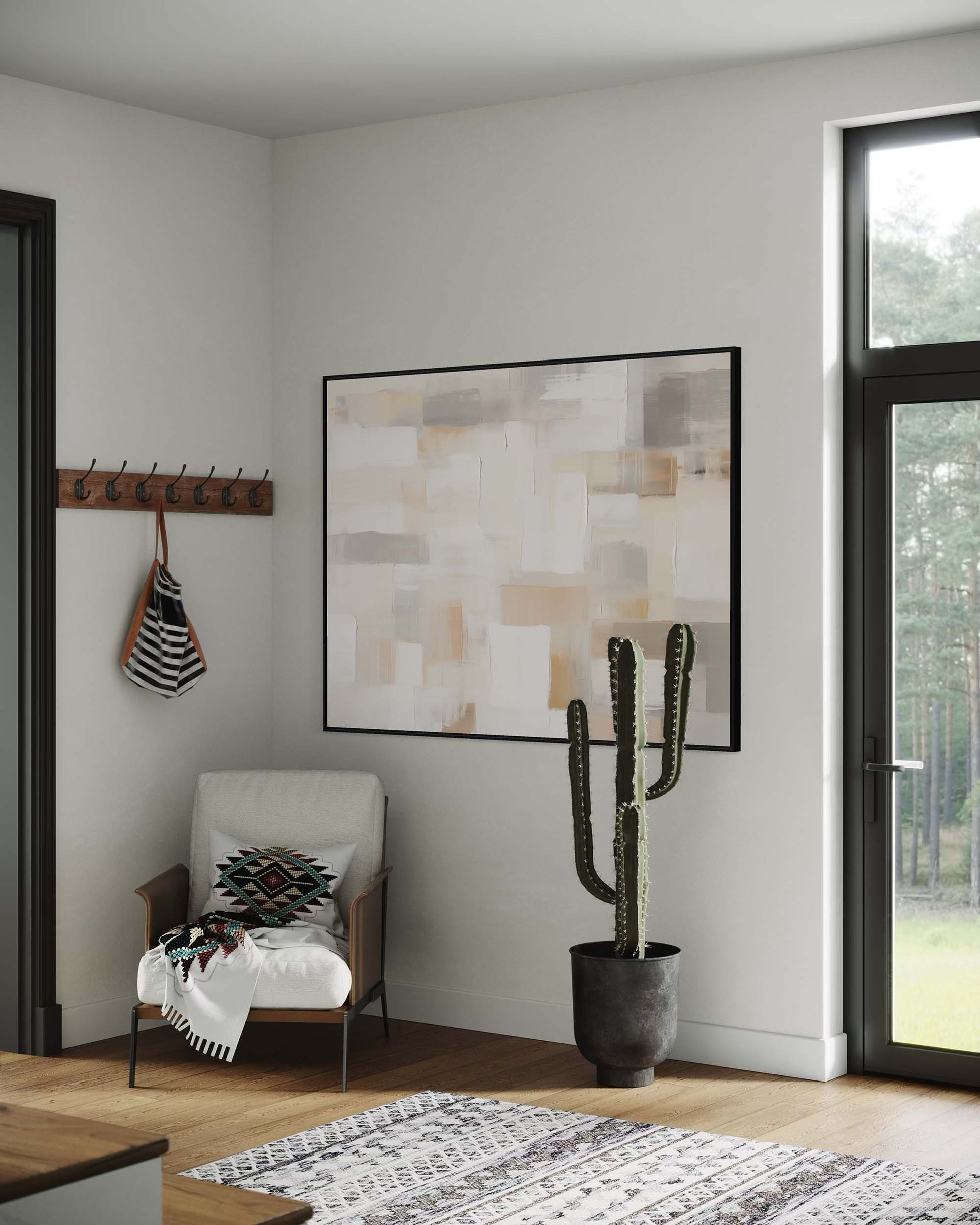 Modern interior with abstract art, cactus, and chair in a well-lit room.