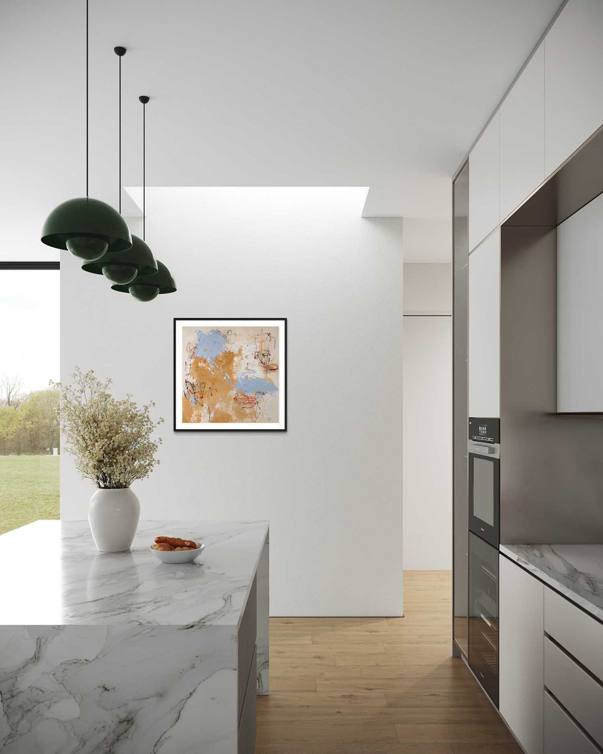 Modern kitchen interior with marble countertop, pendant lights, and wall art.