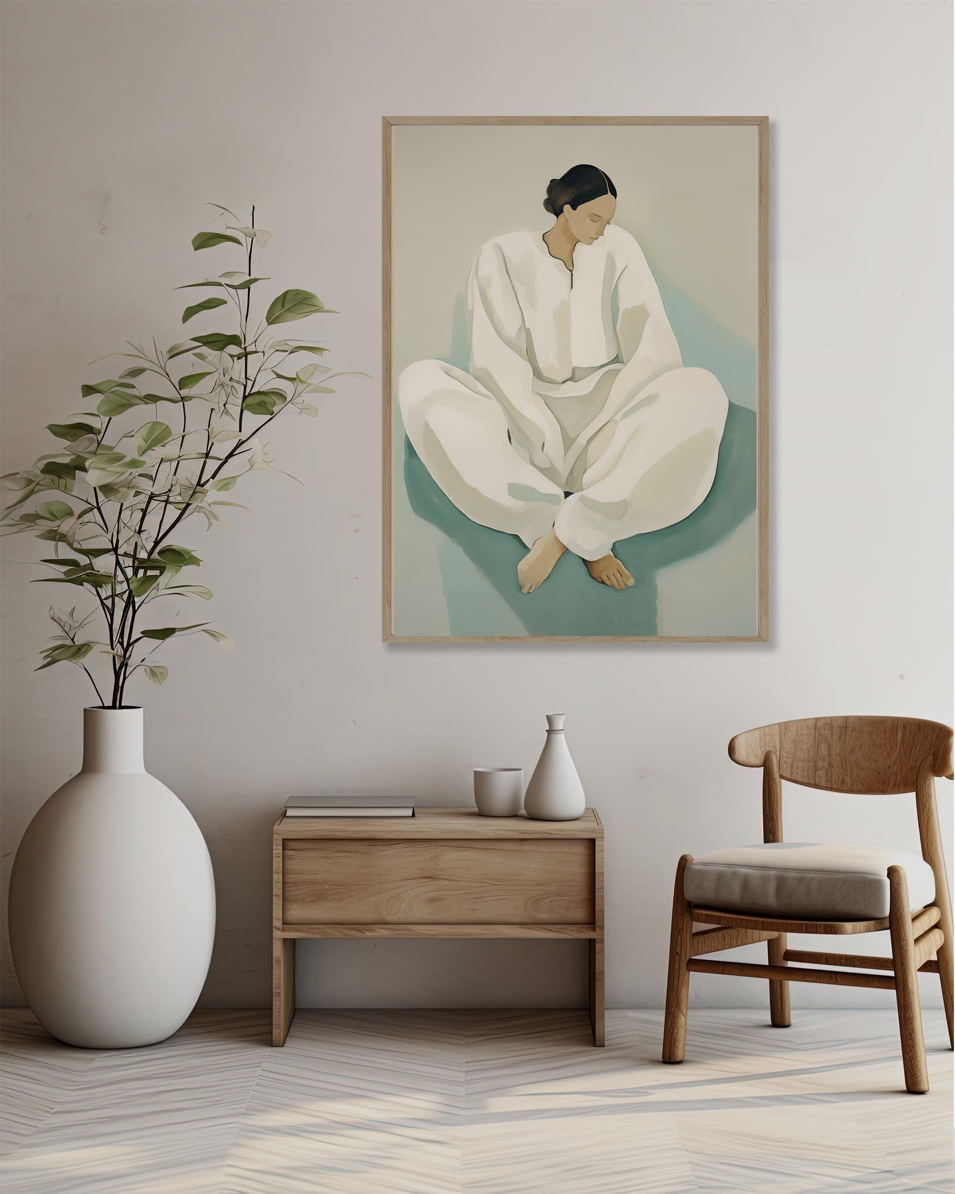 Room interior with a large vase, wooden side table, chair, and framed artwork of a person sitting.