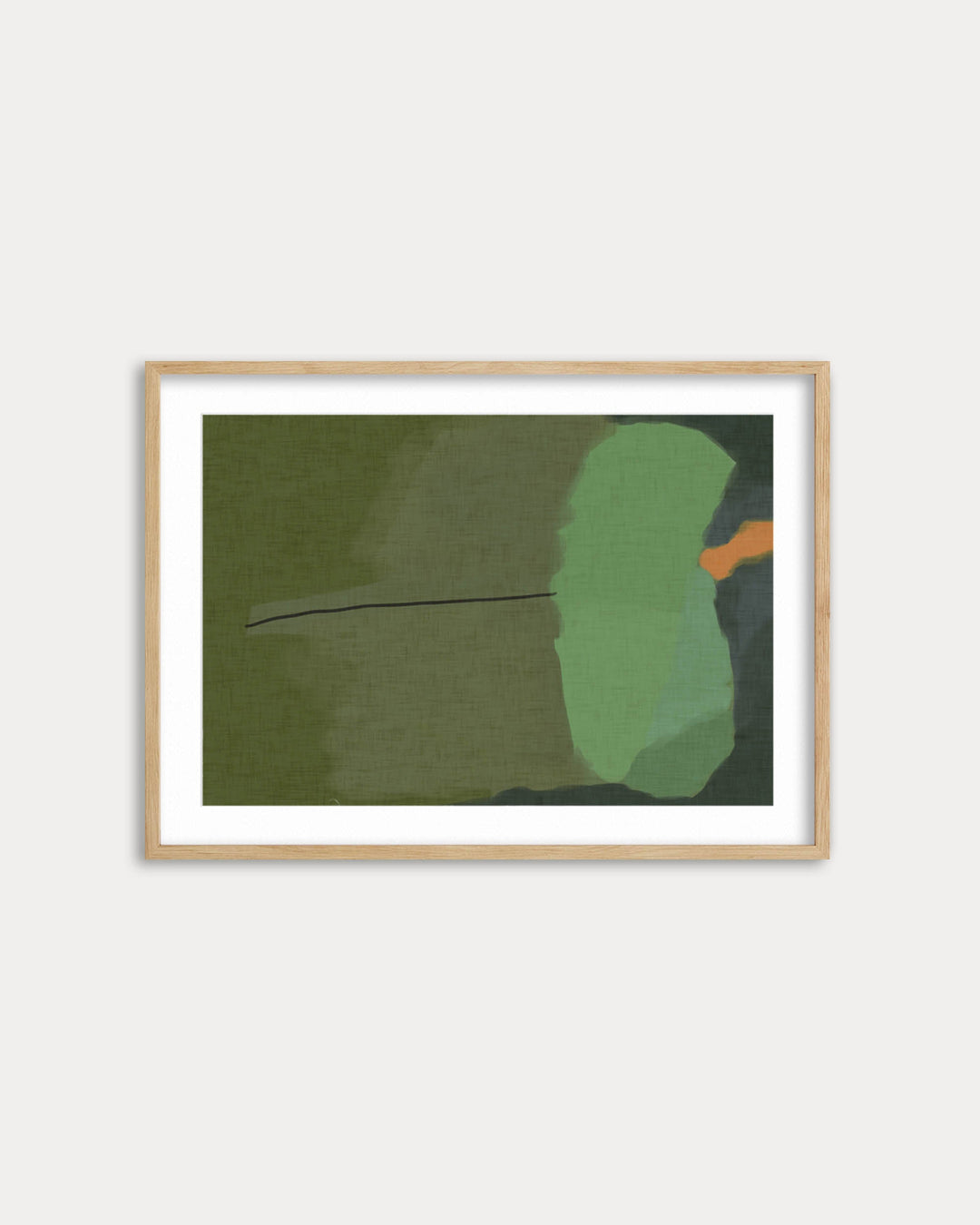 Framed abstract art piece with green and orange shapes on a white wall