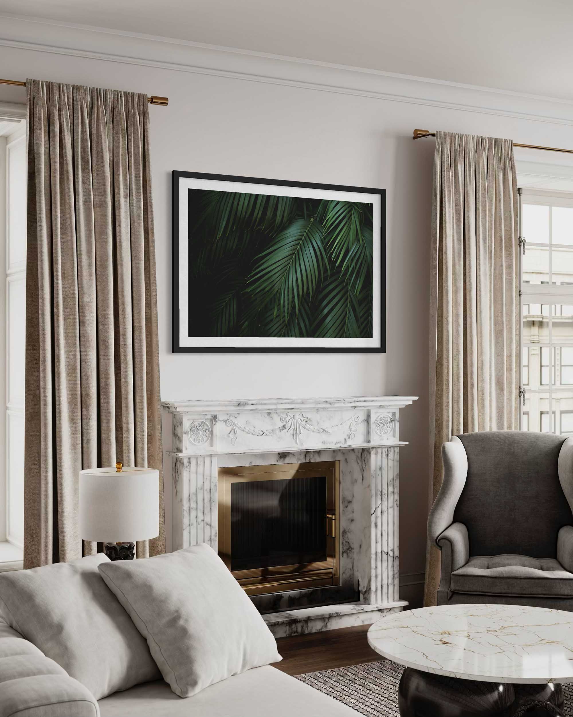 Living room with marble fireplace, gray sofa, and framed leaf print on wall.