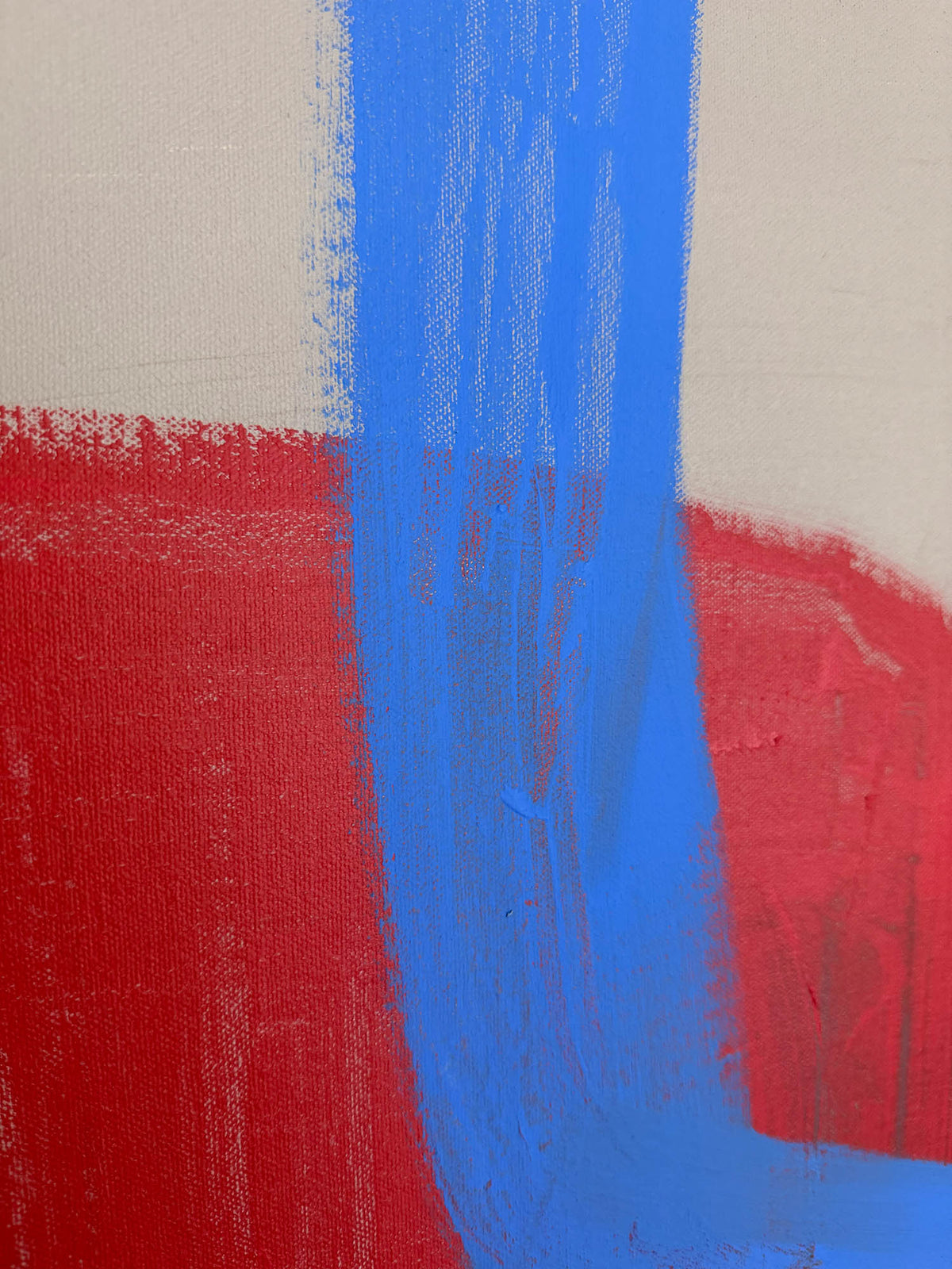 Abstract canvas painting featuring bold vertical and horizontal brushstrokes in bright blue and red on a warm off-white background.