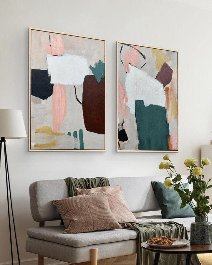 a large set of 2 abstract canvas artwork in the living room above a sofa