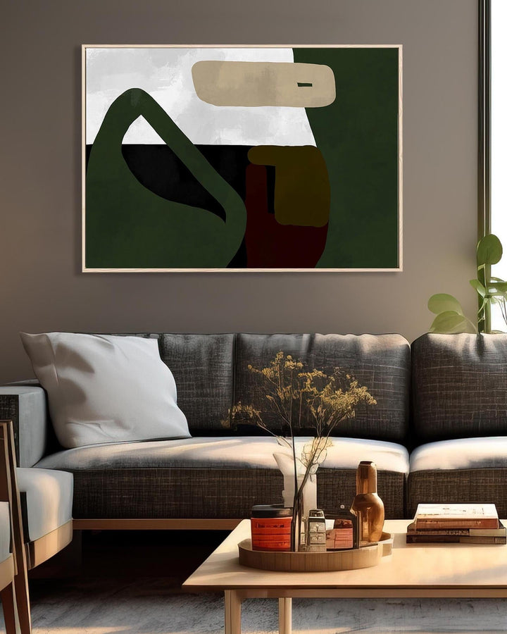 Living room with a gray sofa, abstract art on the wall, and a coffee table with decorative items.