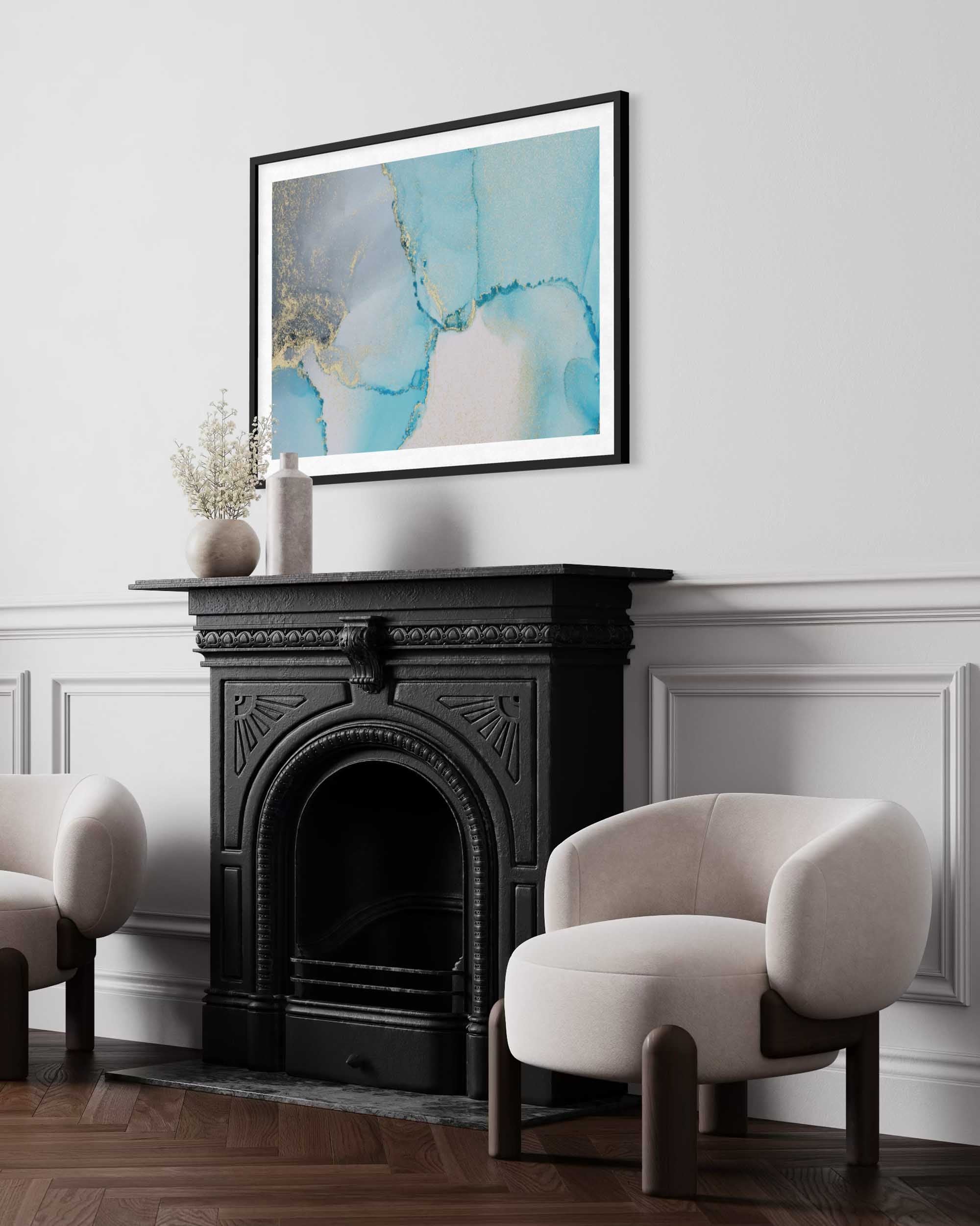 Living room with a black fireplace, white chairs, and a framed abstract painting on the wall.