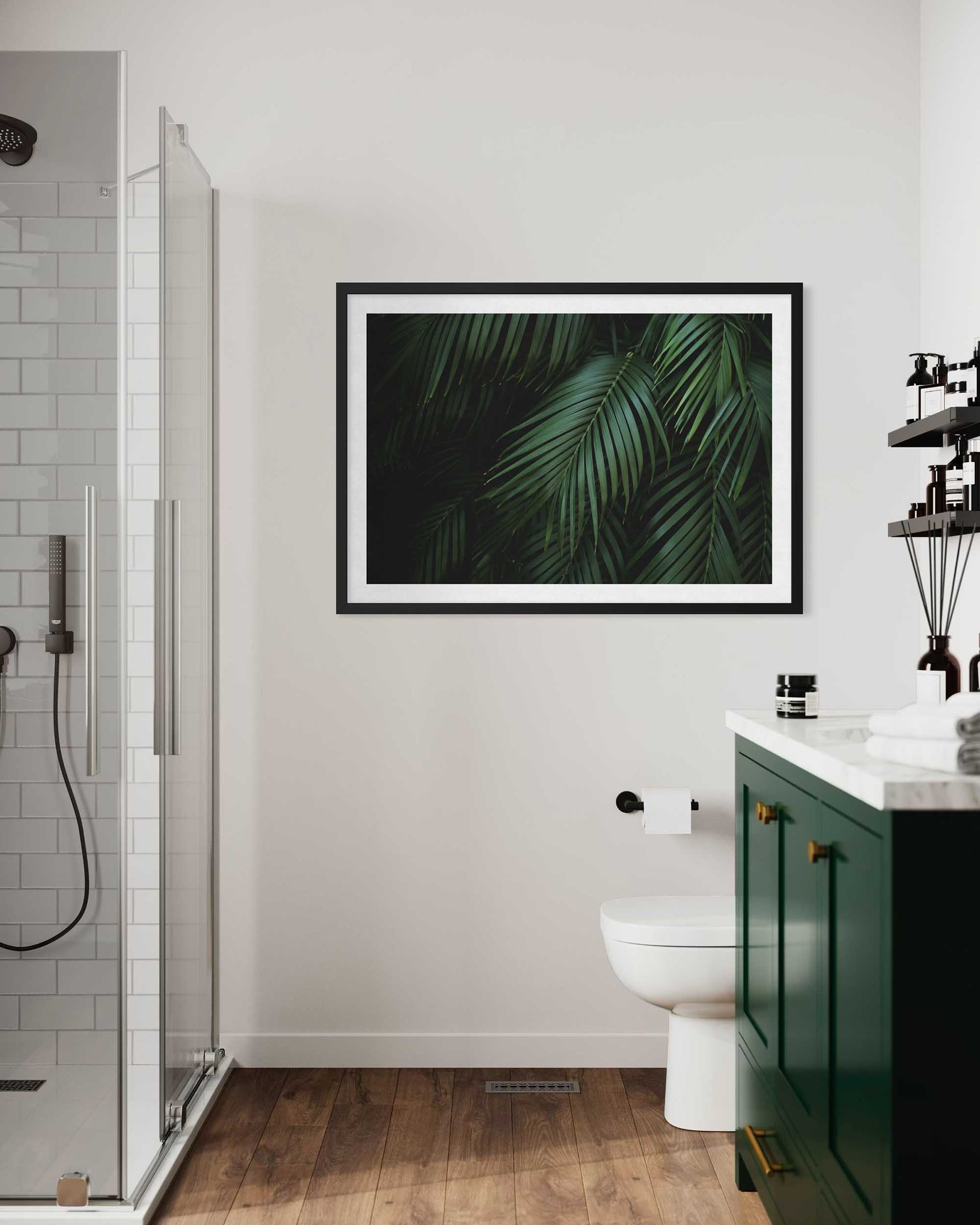 Bathroom with a framed leaf print on the wall