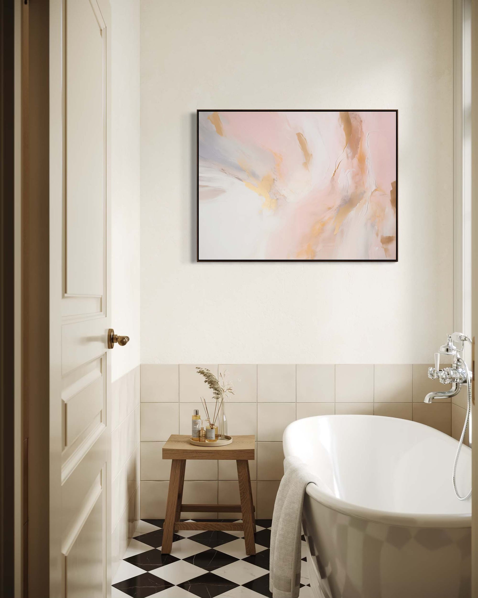 Bathroom interior with a freestanding bathtub, abstract art on the wall, and a wooden stool.