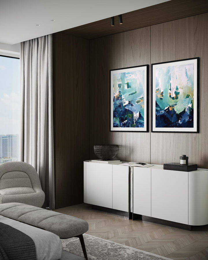 Modern living room with abstract art on the wall and a white cabinet.