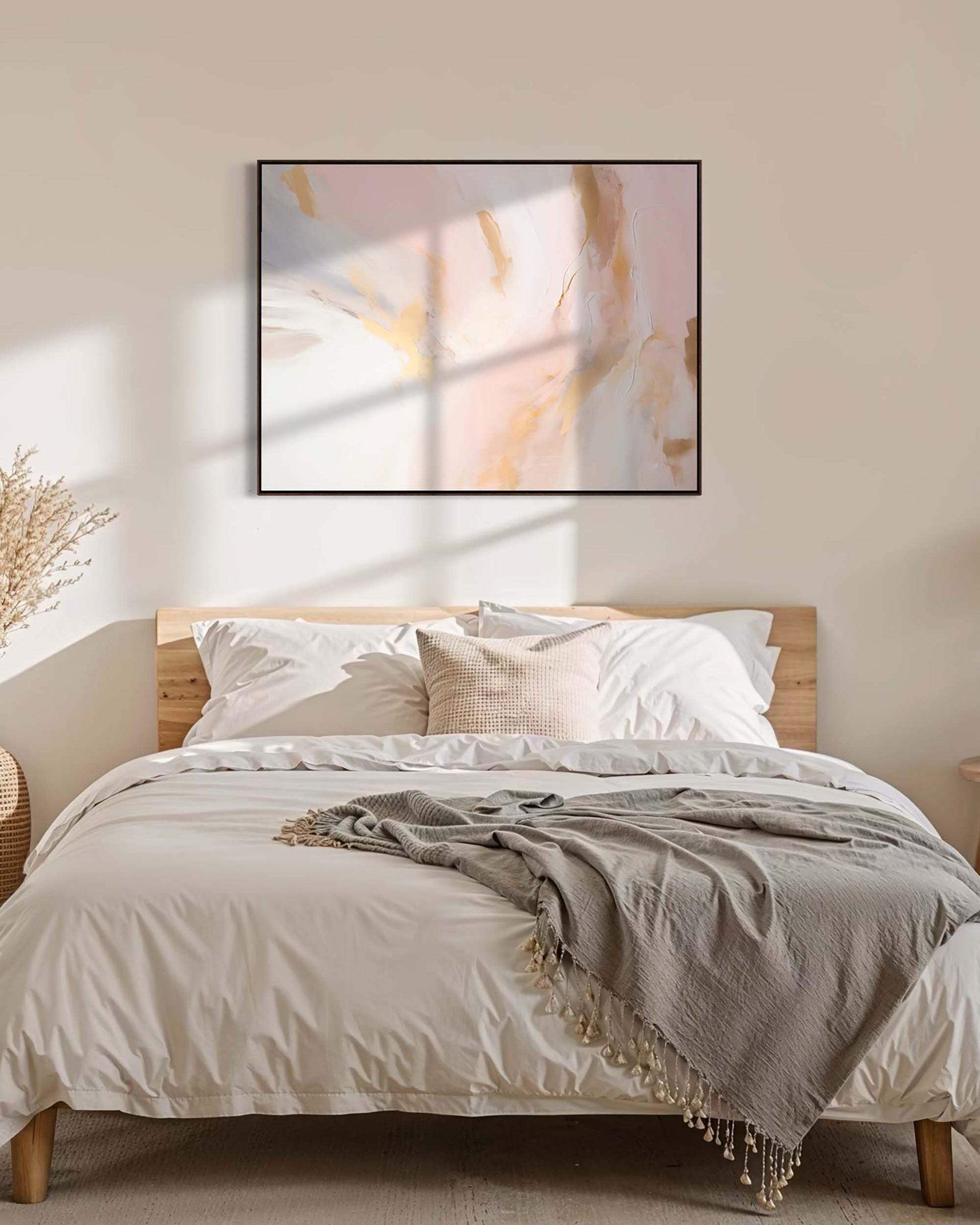 Bedroom with a wooden headboard, white bedding, and abstract art on the wall.