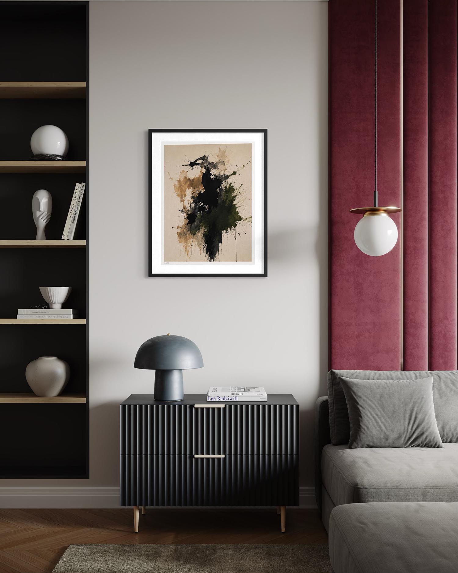 A framed abstract art print with black, green, and brown brushstrokes on a beige background, displayed in a modern living room setting above a dark ribbed cabinet.