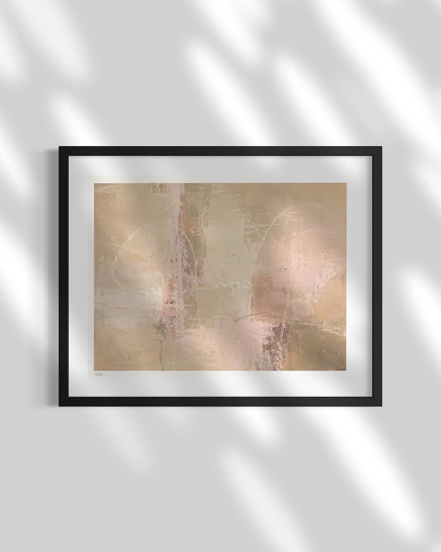 Framed abstract wall art with soft beige, blush, and cream tones, shown in a black frame with a white mat against a light gray wall with dappled shadows.