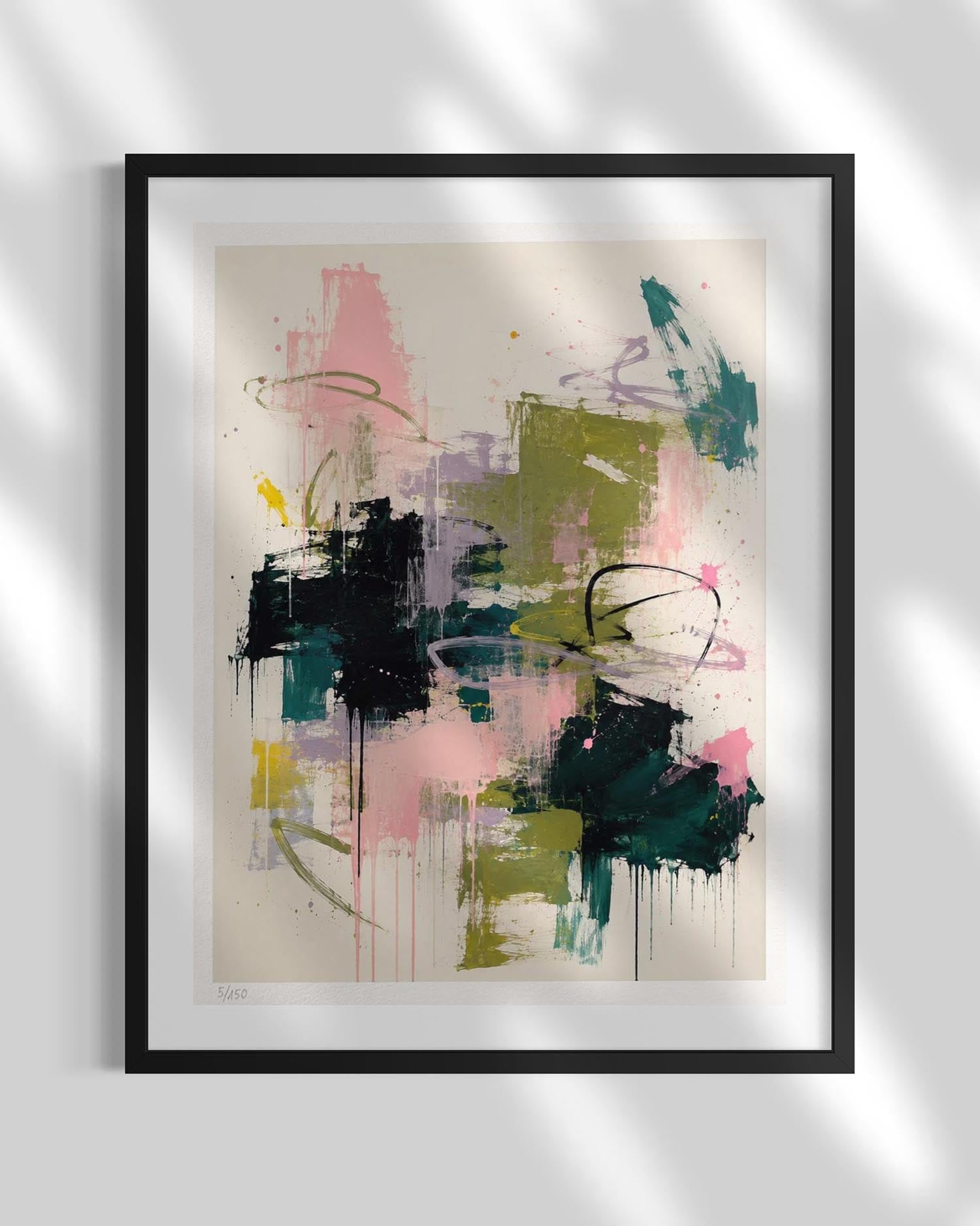 Framed abstract wall art featuring expressive brushstrokes and drips in pink, teal, olive green, black, and cream, displayed against a light gray wall with soft diagonal shadows.
