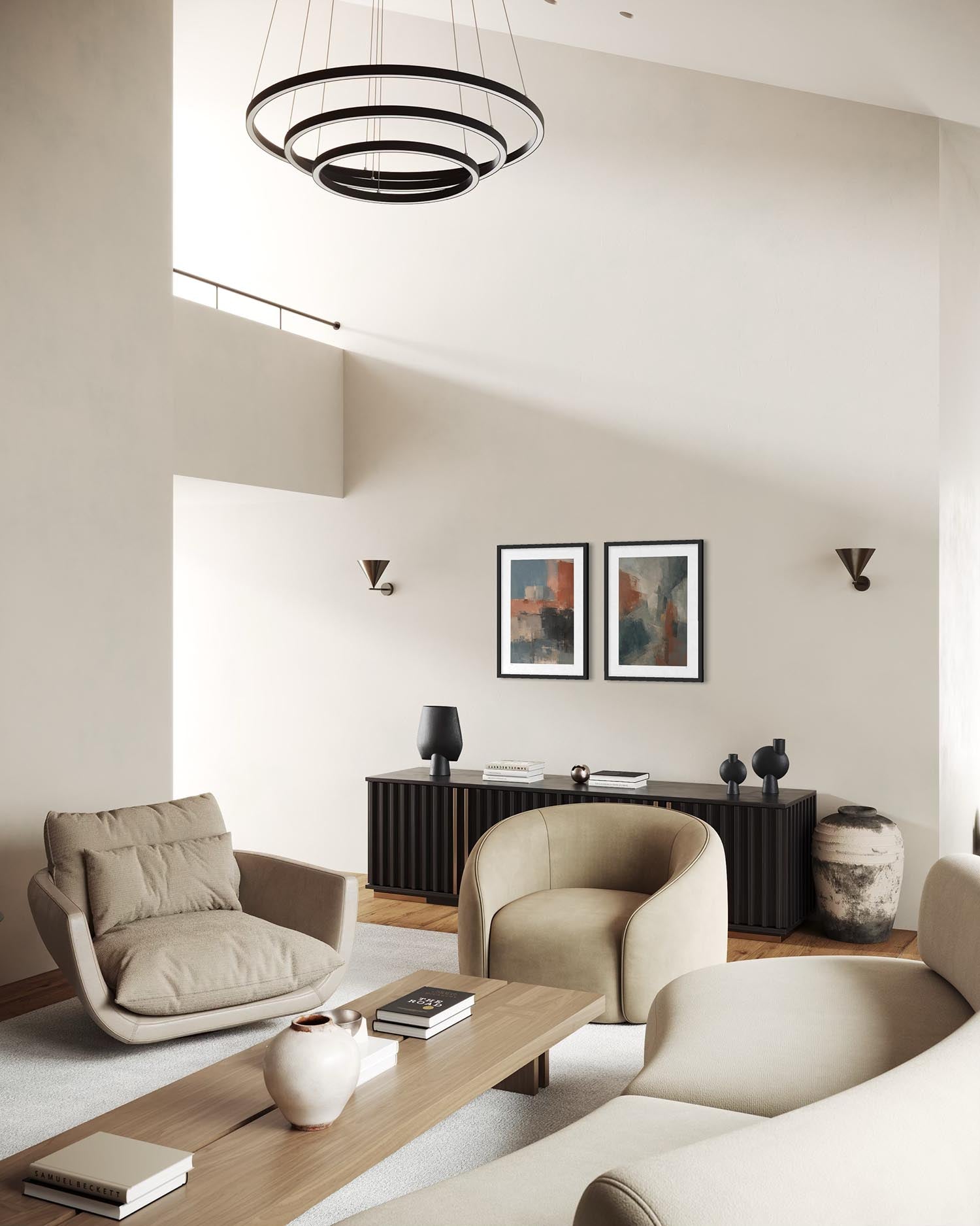 A modern living room interior with neutral beige and cream furniture, including a curved armchair, a matching lounge chair, a sofa, a wooden coffee table, wall sconces, framed abstract art, and a black ring chandelier.