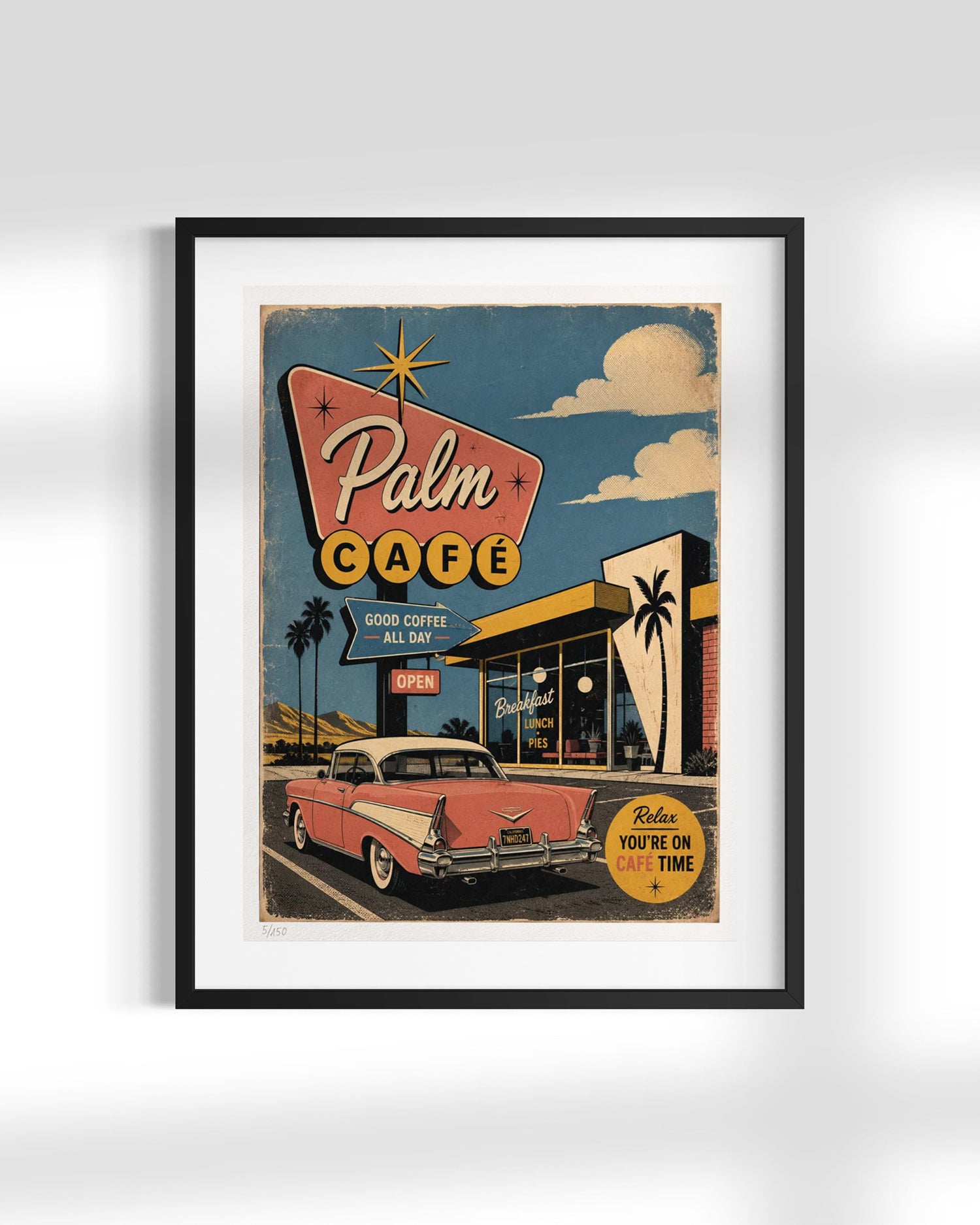 A framed retro-style poster of a vintage 'Palm Cafe' with a pink classic car, displayed on a light gray wall.