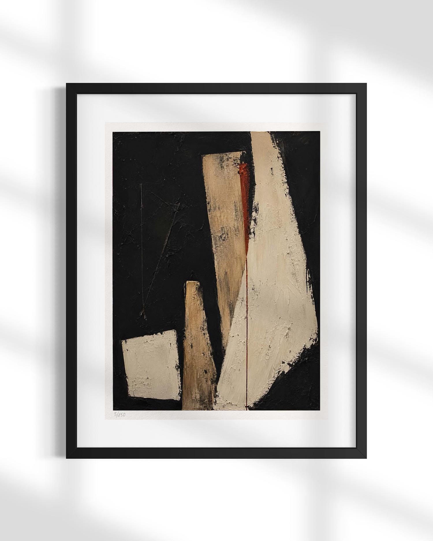 A framed abstract art print featuring geometric shapes in beige, white, and black with a touch of red, presented in a black frame with a white mat against a white wall with soft shadow overlays.