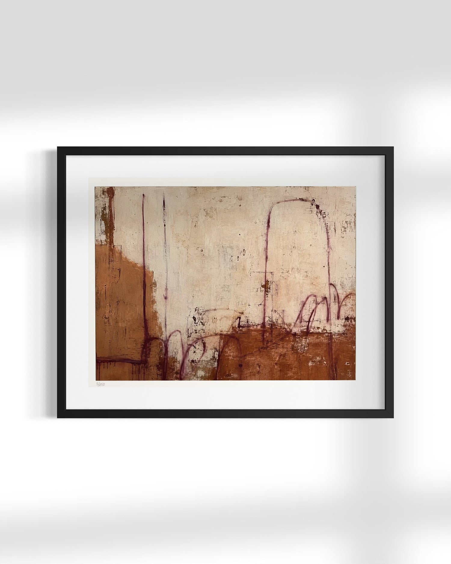 Framed abstract art print featuring textured brown and beige tones with delicate reddish-purple sketch-like lines, presented in a black frame with a white mat against a light gray wall.