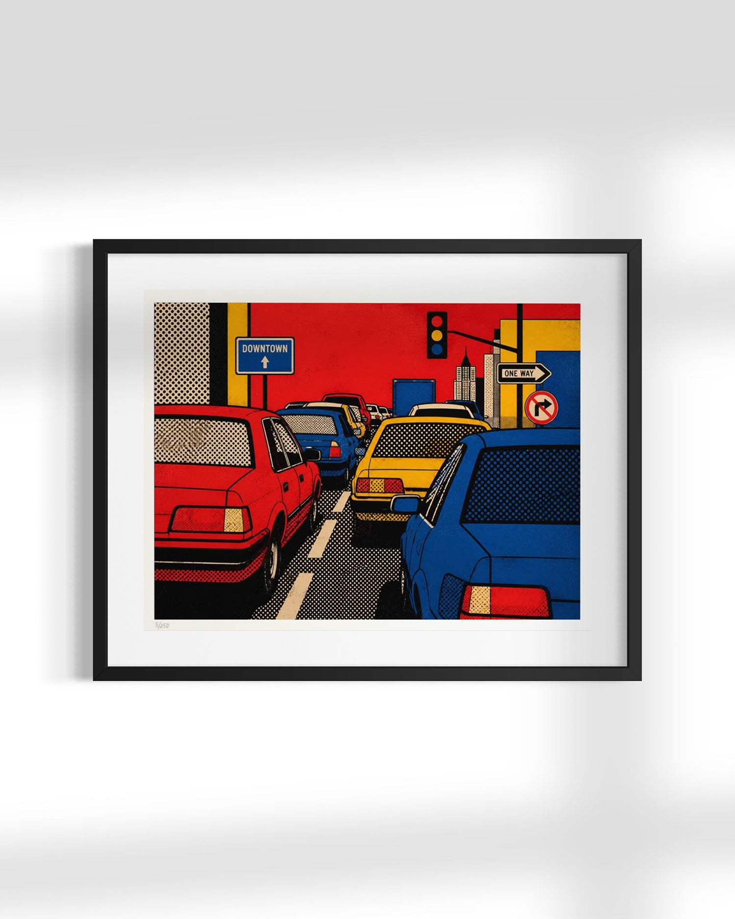 A framed pop-art style city street print featuring colorful cars and urban elements, displayed against a light gray wall with a soft shadow.