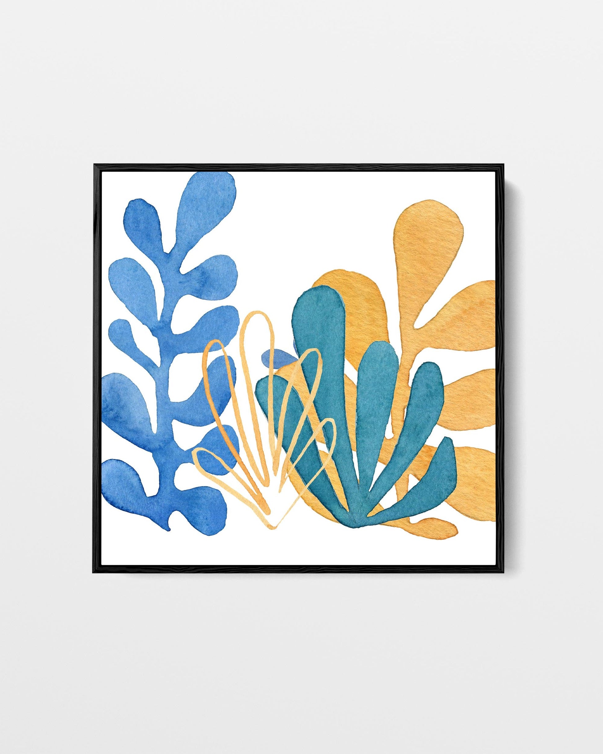 Framed artwork with blue and orange abstract leaf shapes on a white background