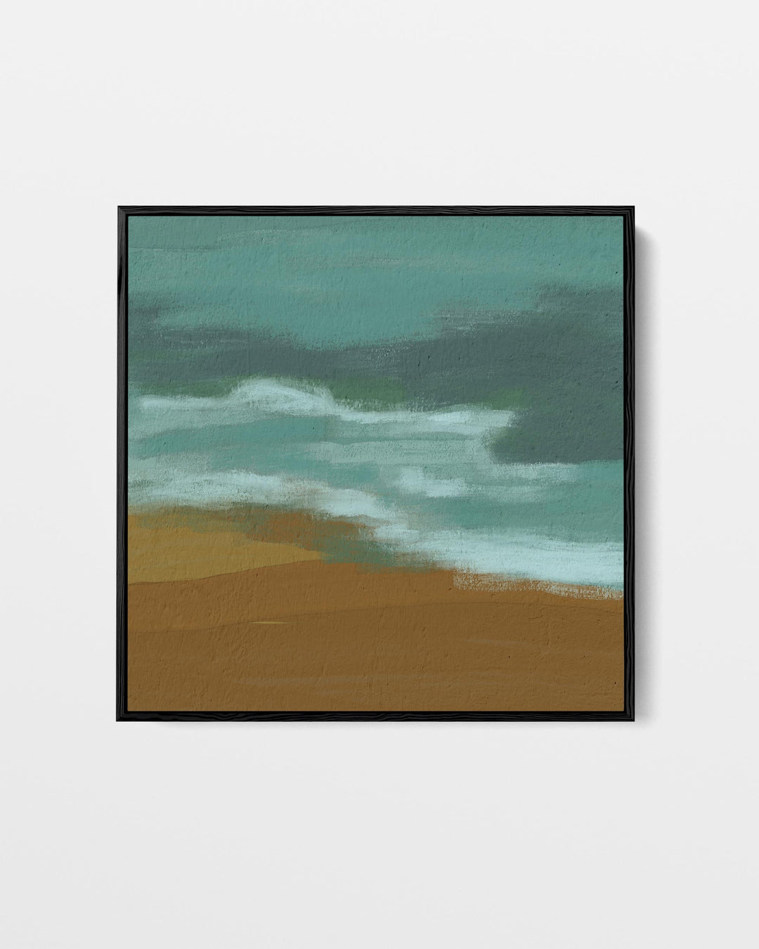 Framed artwork of a beach scene with ocean waves and sand.