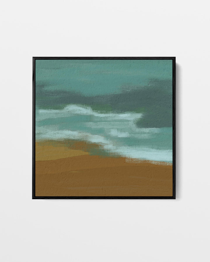 Framed artwork of a beach scene with ocean waves and sand.