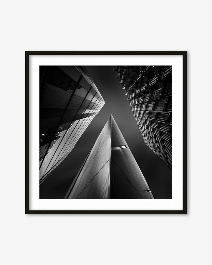 Framed black and white photograph of architectural structures.