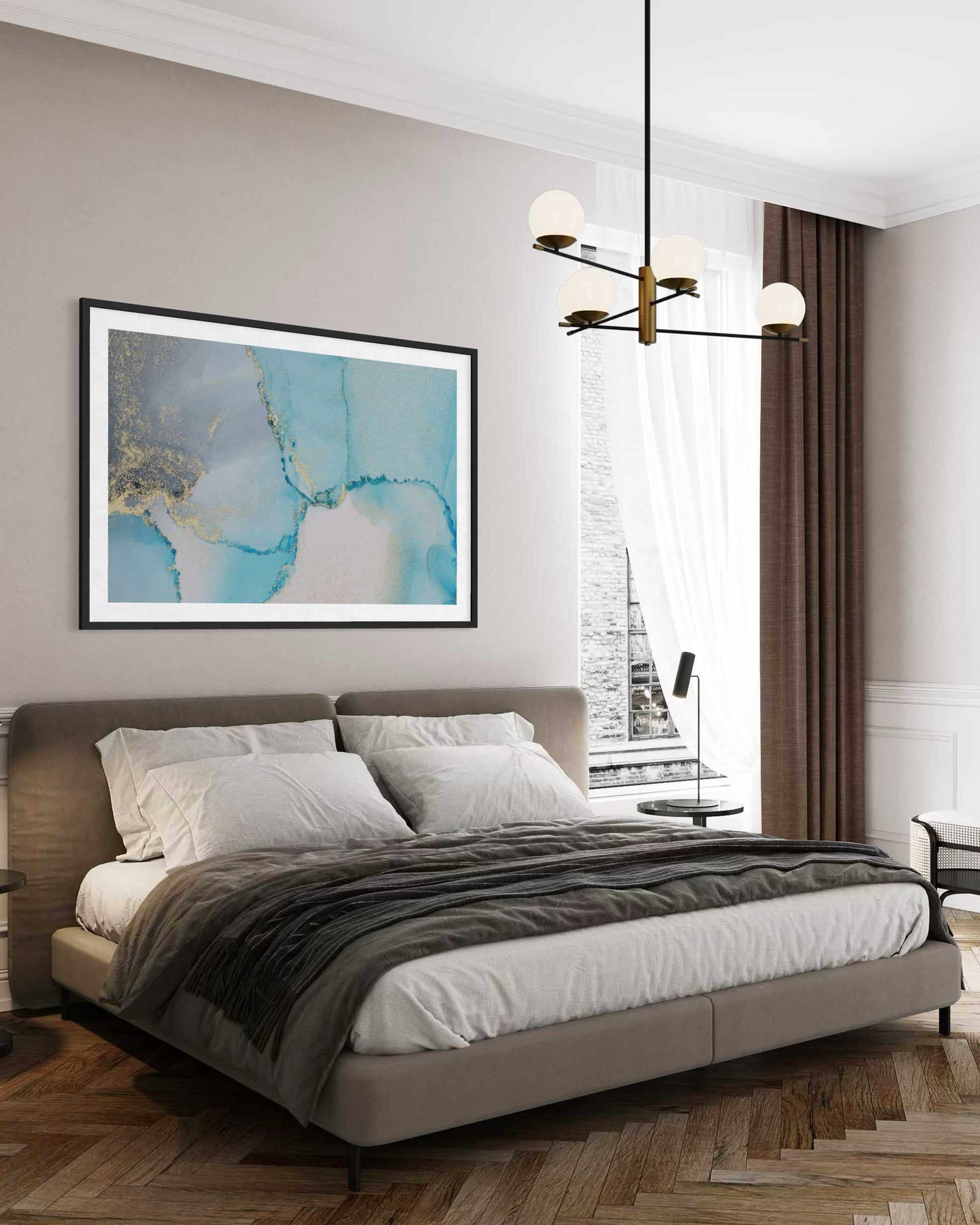 Modern bedroom with a bed, artwork on the wall, and a chandelier.