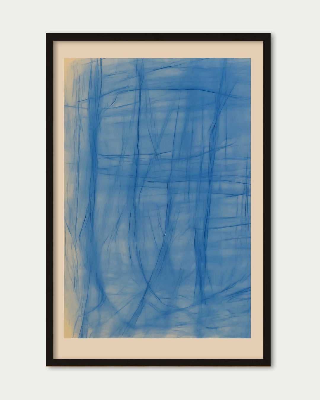 Framed abstract artwork with blue brush strokes on a white background