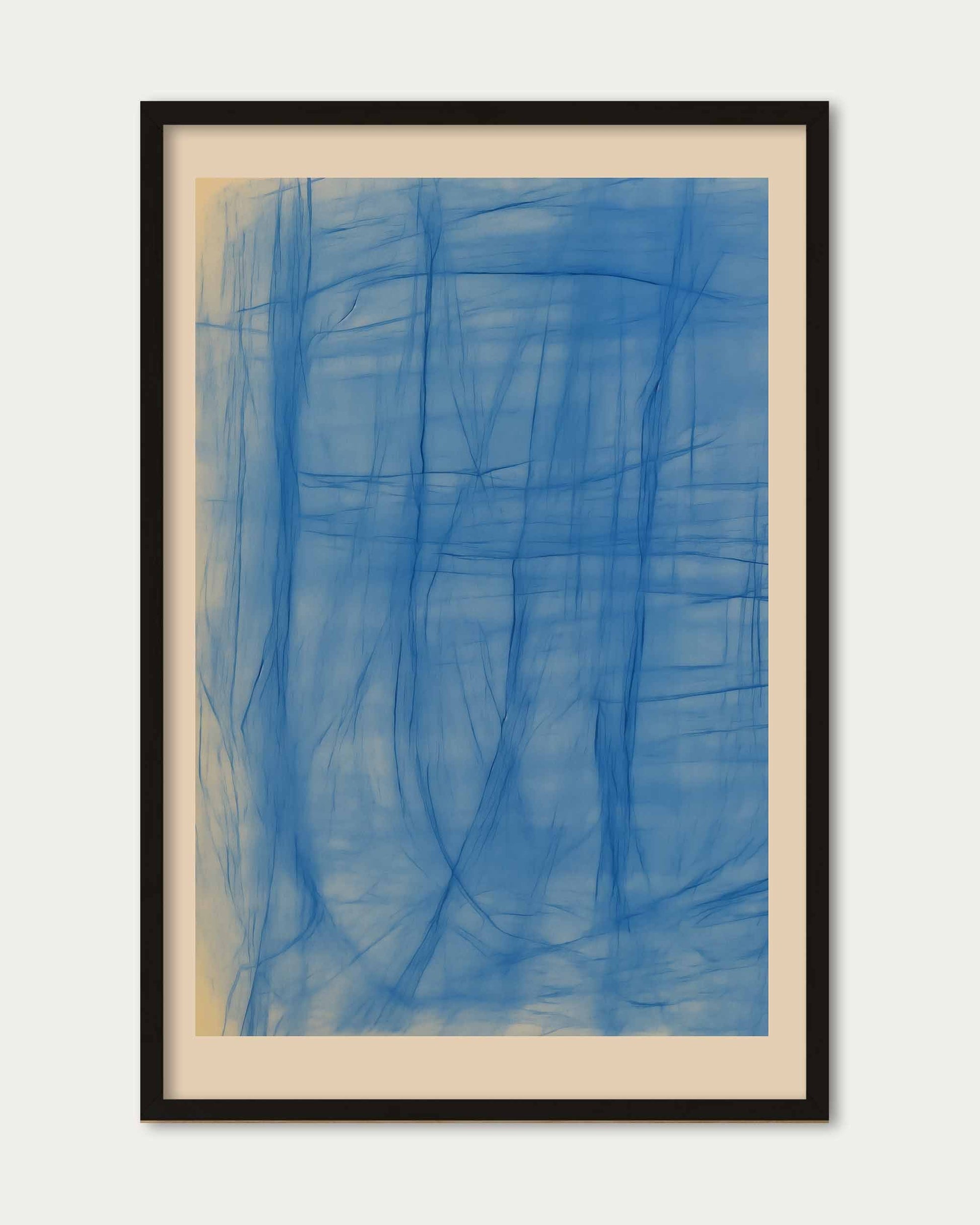 Framed abstract artwork with blue brush strokes on a white background