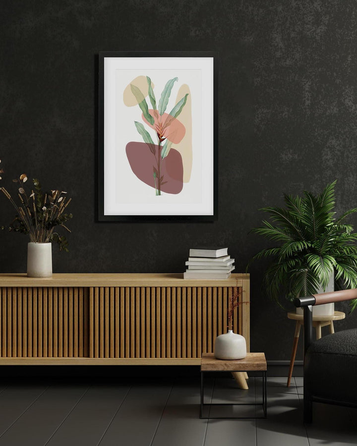 Framed abstract art print on a dark wall above a wooden cabinet with decorative items.