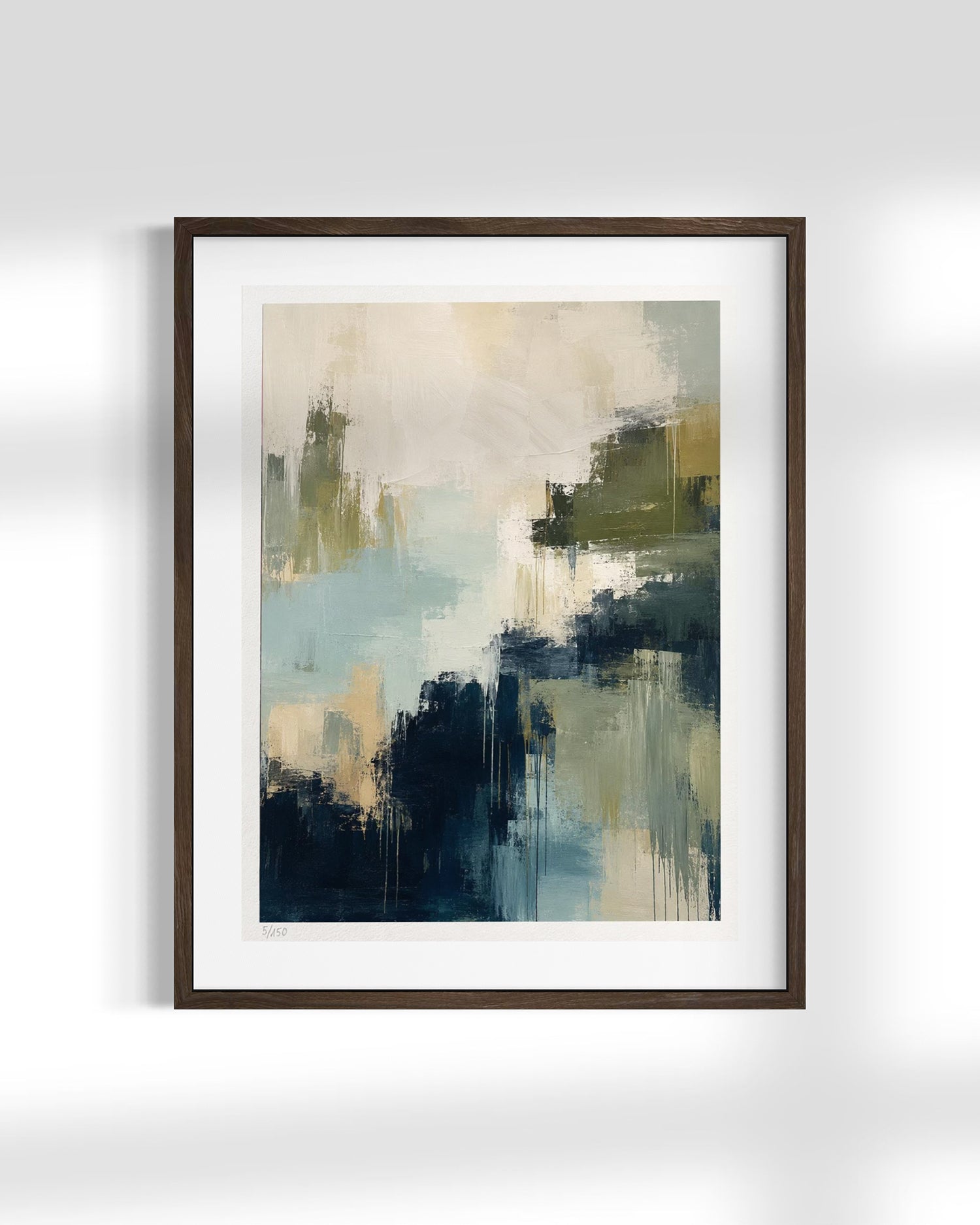 Framed abstract wall art featuring a modern painterly composition in shades of navy, teal, olive green, cream, and gray, set in a dark brown frame with a white mat against a light gray wall.